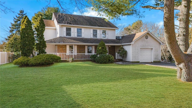 view of front of home featuring a front yard, a porch, and a garage