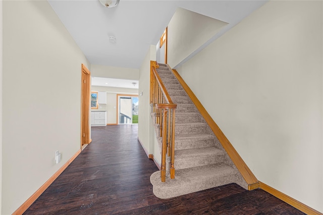 stairs featuring wood-type flooring