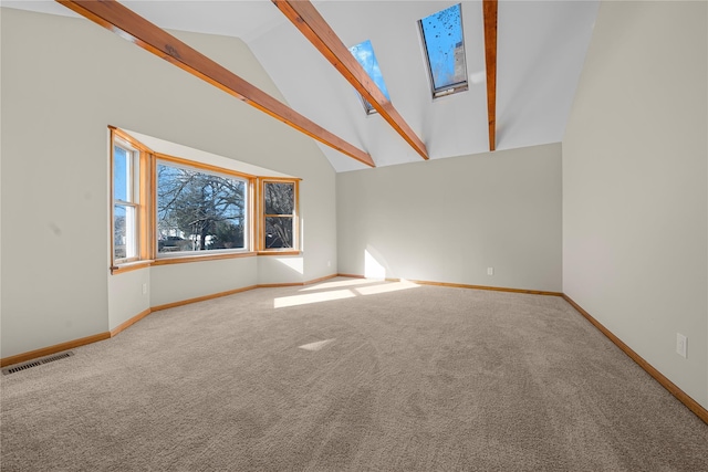 unfurnished living room with carpet flooring, beam ceiling, and high vaulted ceiling