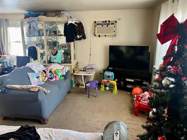 living room featuring carpet and an AC wall unit