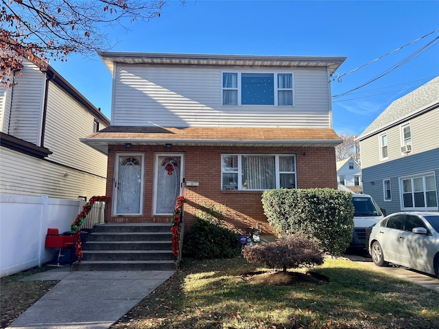 front facade featuring a front yard