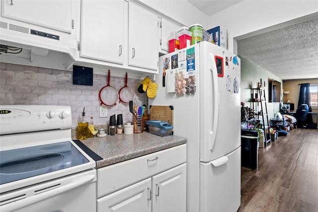 kitchen with white cabinets, white appliances, tasteful backsplash, and extractor fan