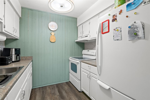 kitchen featuring white cabinetry, sink, dark wood-type flooring, and white appliances