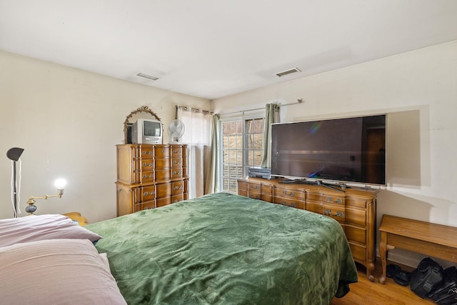 bedroom featuring hardwood / wood-style flooring