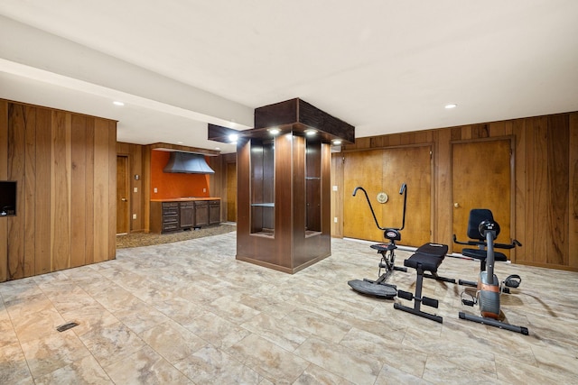 workout room with wooden walls