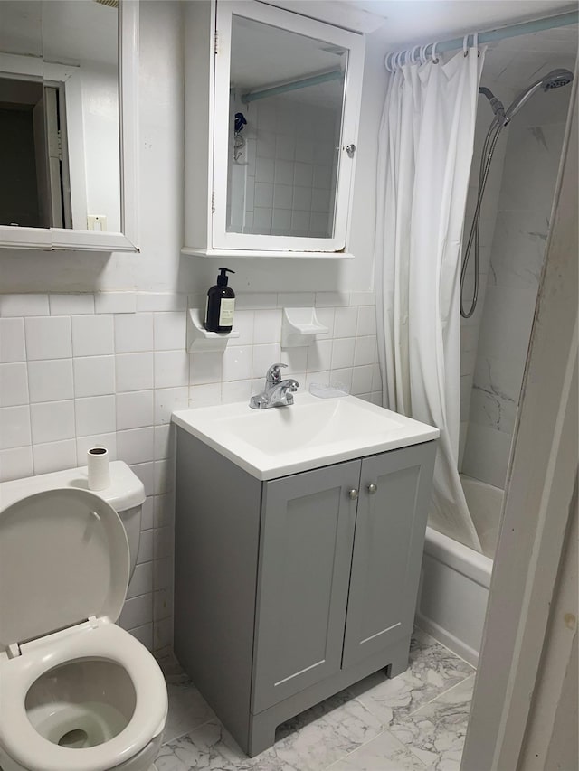 full bathroom with shower / bath combo, toilet, tile walls, and vanity