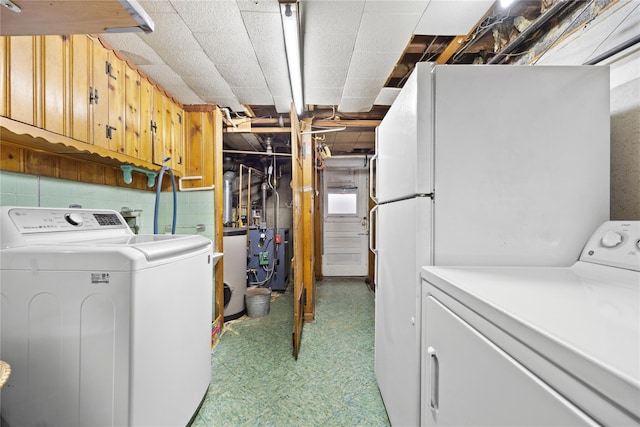 laundry area featuring washing machine and clothes dryer