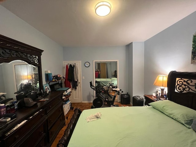 bedroom featuring dark hardwood / wood-style flooring