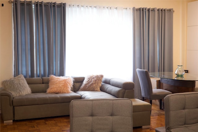 living room featuring parquet floors