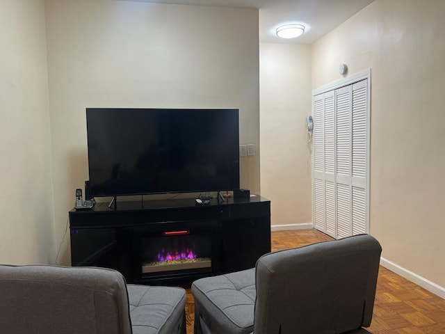 living room featuring parquet floors