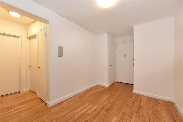 spare room featuring light hardwood / wood-style floors