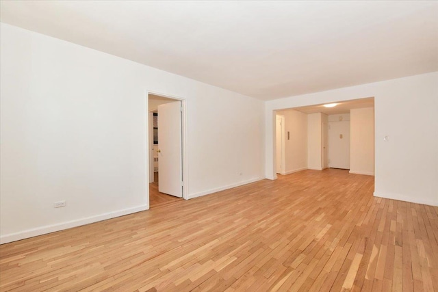 spare room with light hardwood / wood-style flooring