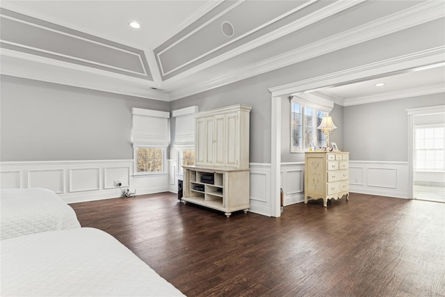 bedroom with multiple windows, dark hardwood / wood-style flooring, and ornamental molding