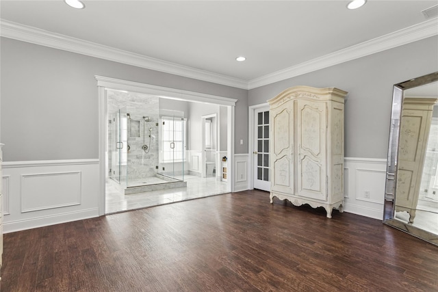 entrance foyer featuring crown molding and dark hardwood / wood-style floors