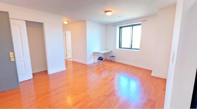 spare room featuring hardwood / wood-style flooring