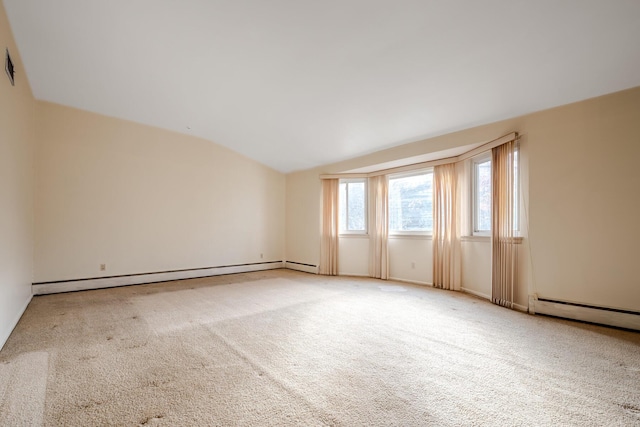 carpeted spare room with a baseboard heating unit and lofted ceiling