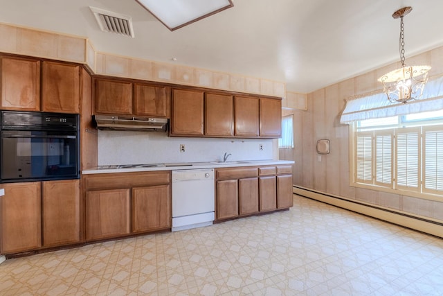 kitchen featuring sink, white dishwasher, a chandelier, pendant lighting, and black oven