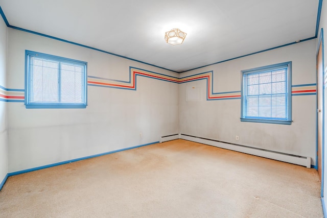 carpeted spare room with a baseboard radiator