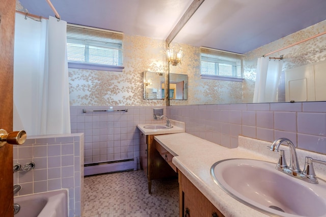 bathroom with vanity, shower / bath combination with curtain, baseboard heating, and tile walls