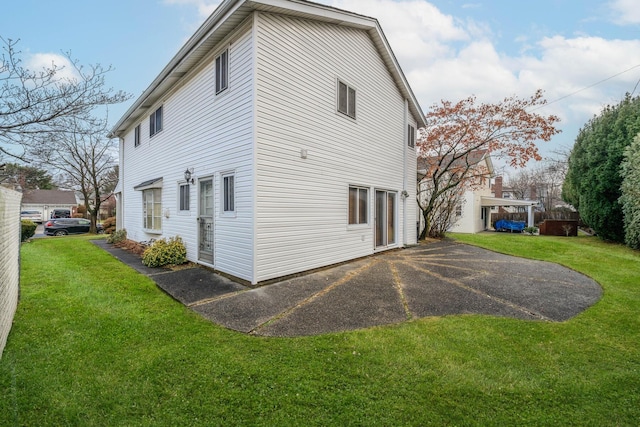 view of home's exterior featuring a lawn