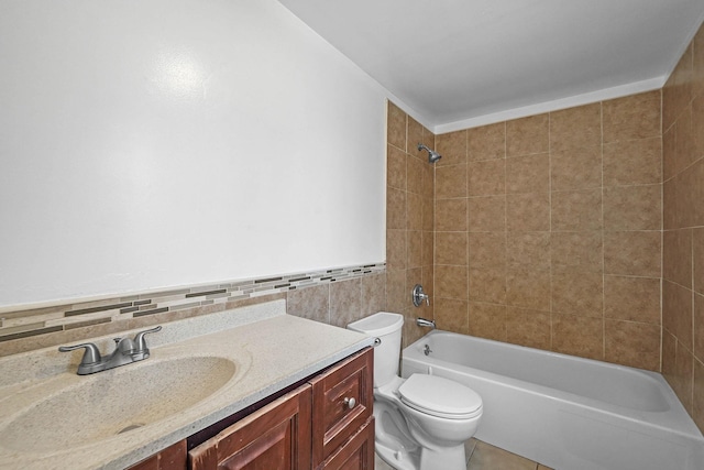 full bathroom with backsplash, vanity, tile patterned flooring, toilet, and tiled shower / bath