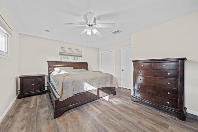 bedroom with ceiling fan and wood-type flooring