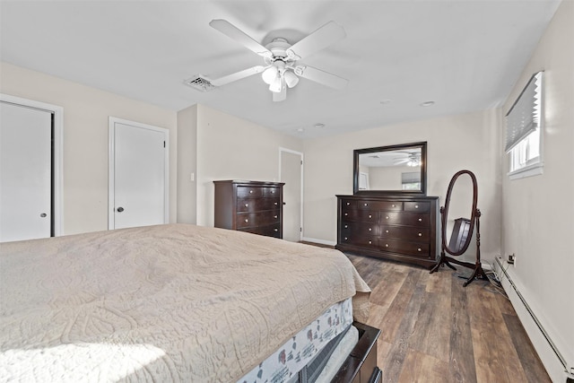 bedroom featuring dark hardwood / wood-style flooring, a baseboard radiator, and ceiling fan