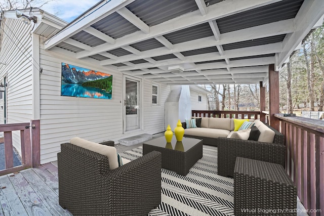 wooden terrace with an outdoor hangout area