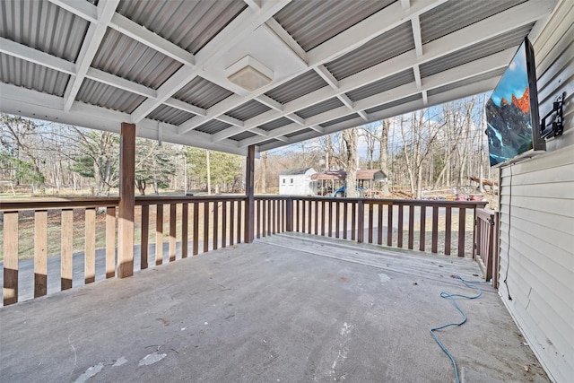 wooden terrace with a playground