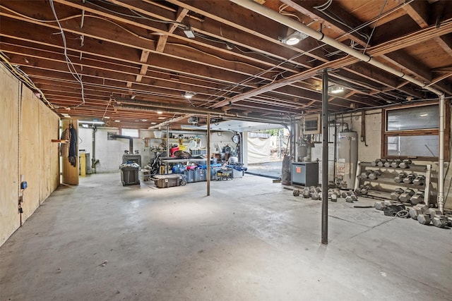 basement with plenty of natural light and gas water heater