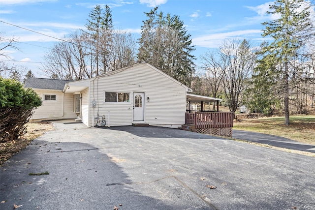 view of front of property with a wooden deck