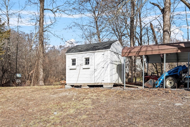 view of outbuilding with a carport