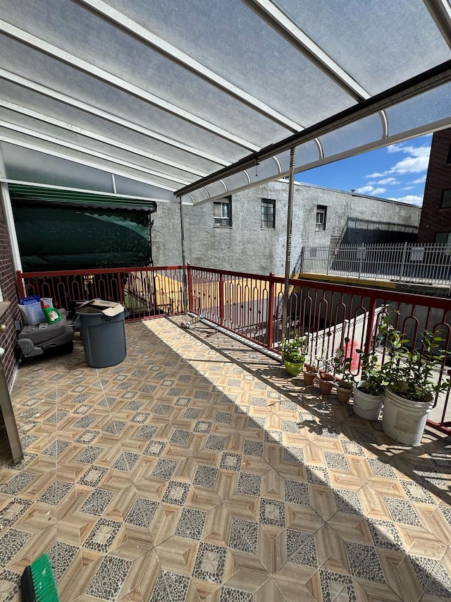 view of patio featuring fence