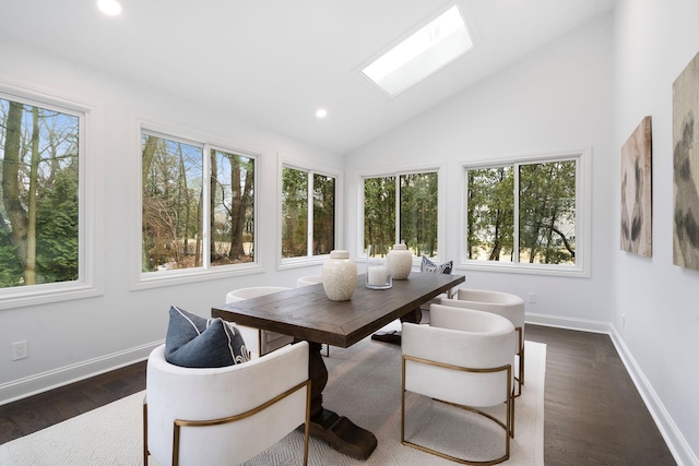 sunroom with plenty of natural light and vaulted ceiling with skylight