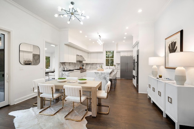 dining area with ornamental molding, a healthy amount of sunlight, dark wood-type flooring, and a chandelier