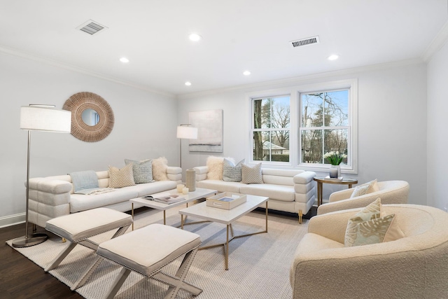 living room with hardwood / wood-style floors and crown molding