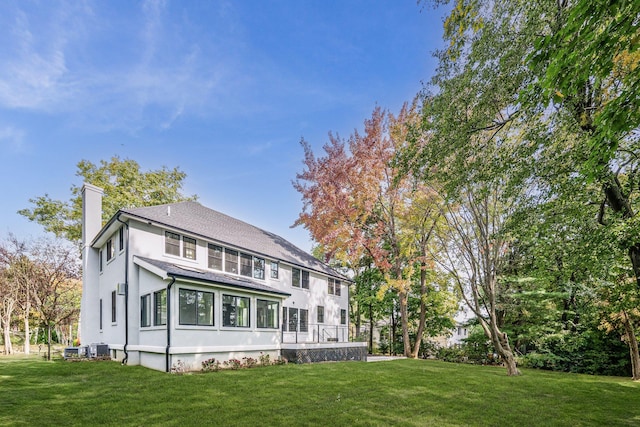 back of house with a yard