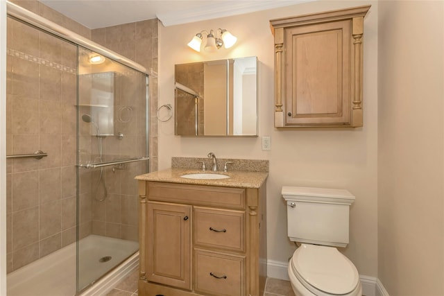 bathroom with toilet, an enclosed shower, vanity, and tile patterned floors