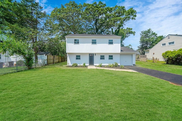 view of front of home featuring a garage and a front yard