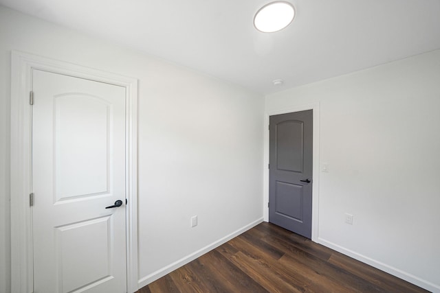 spare room featuring dark hardwood / wood-style floors