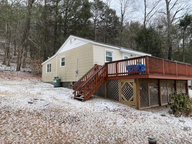 rear view of house featuring a deck