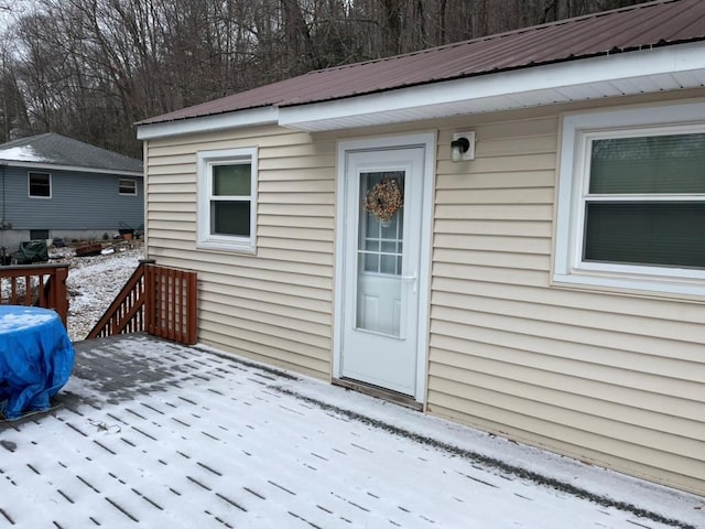 view of snow covered property entrance