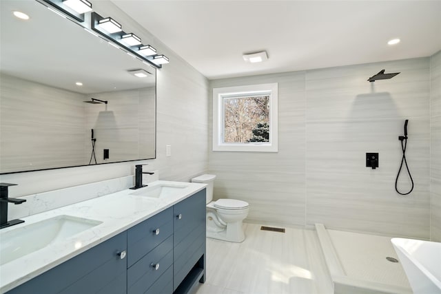 full bathroom featuring double vanity, visible vents, a sink, and tiled shower