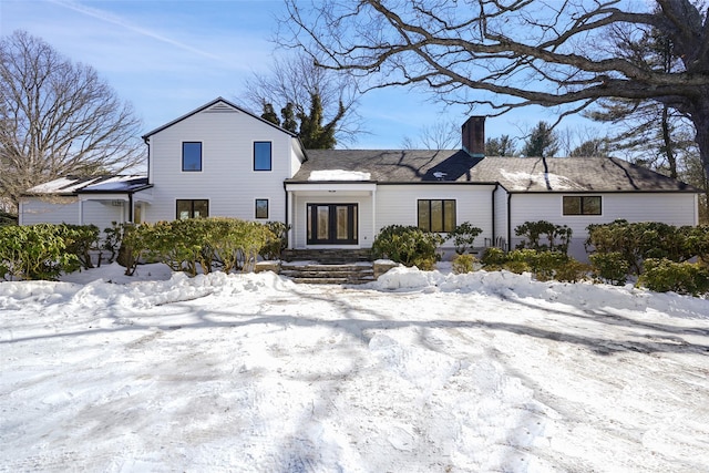 view of front of house featuring a chimney