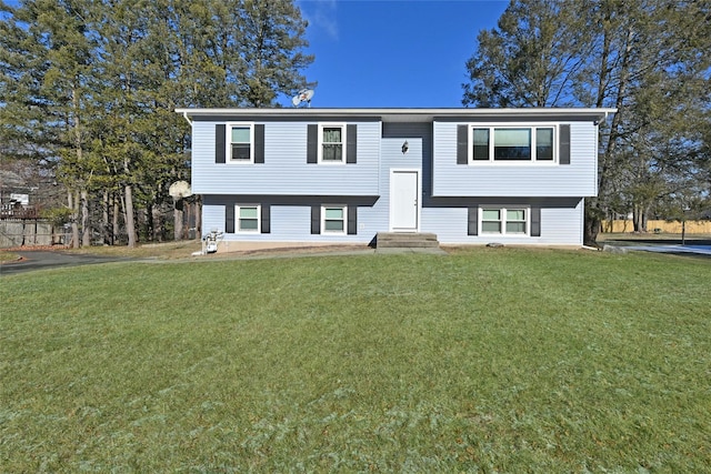 bi-level home with a front lawn