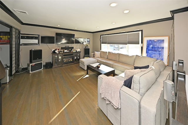 living room featuring hardwood / wood-style floors and crown molding