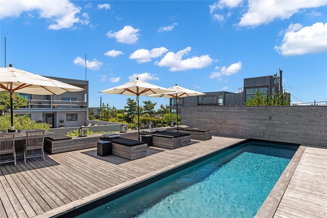 view of swimming pool featuring a deck