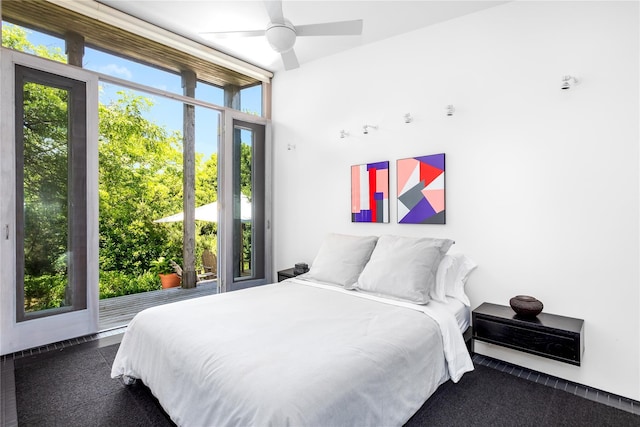 bedroom featuring ceiling fan and multiple windows