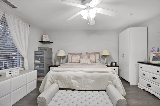 bedroom with dark wood-type flooring and ceiling fan