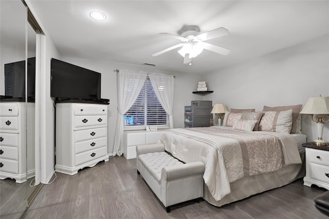 bedroom featuring hardwood / wood-style flooring and ceiling fan